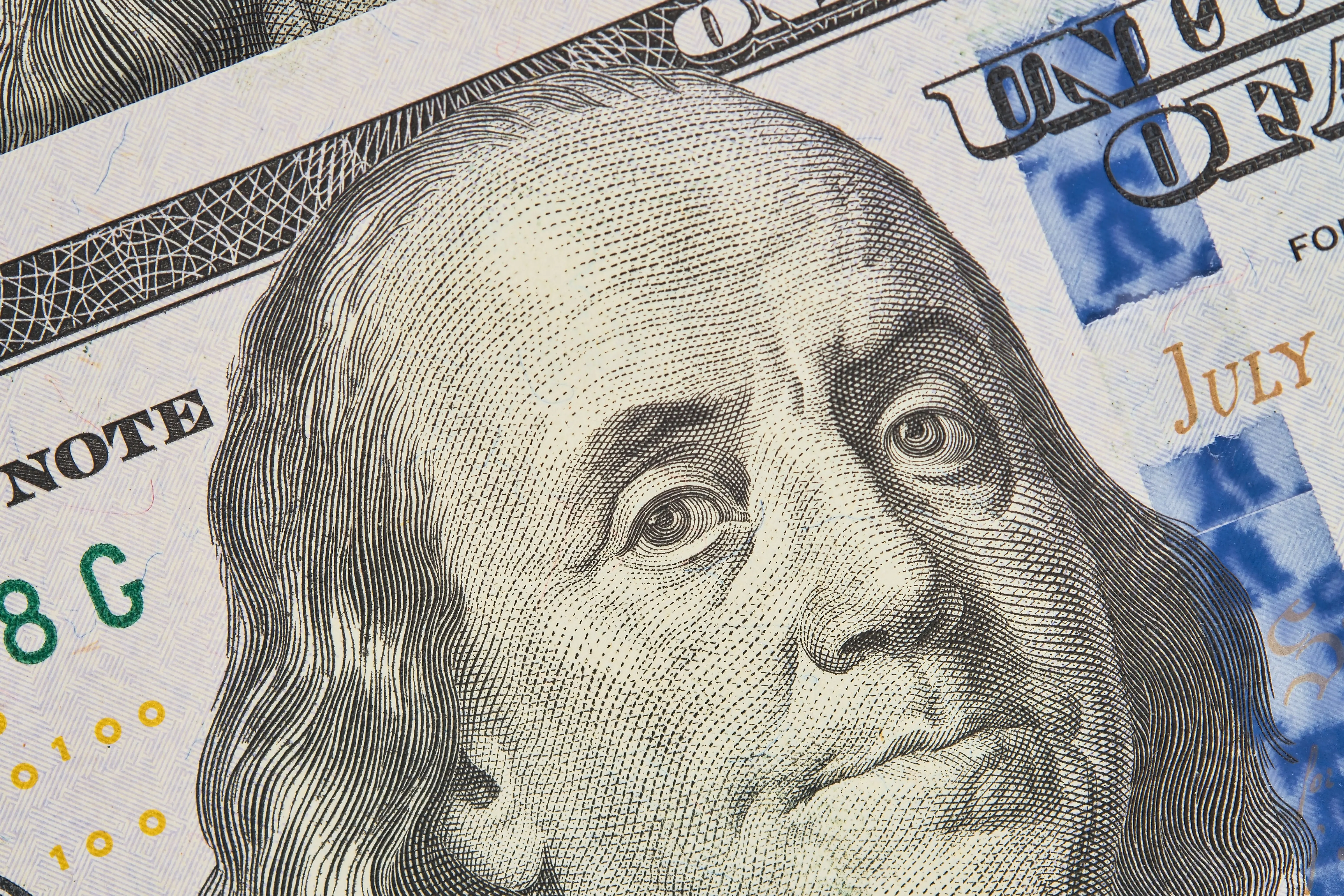 portrait-franklin-hundred-dollar-bill-closeup-one-hundred-us-dollars-banknotes-selective-focus-business-finance-concept-business-news-splash-screen-banner-mockup.jpg
